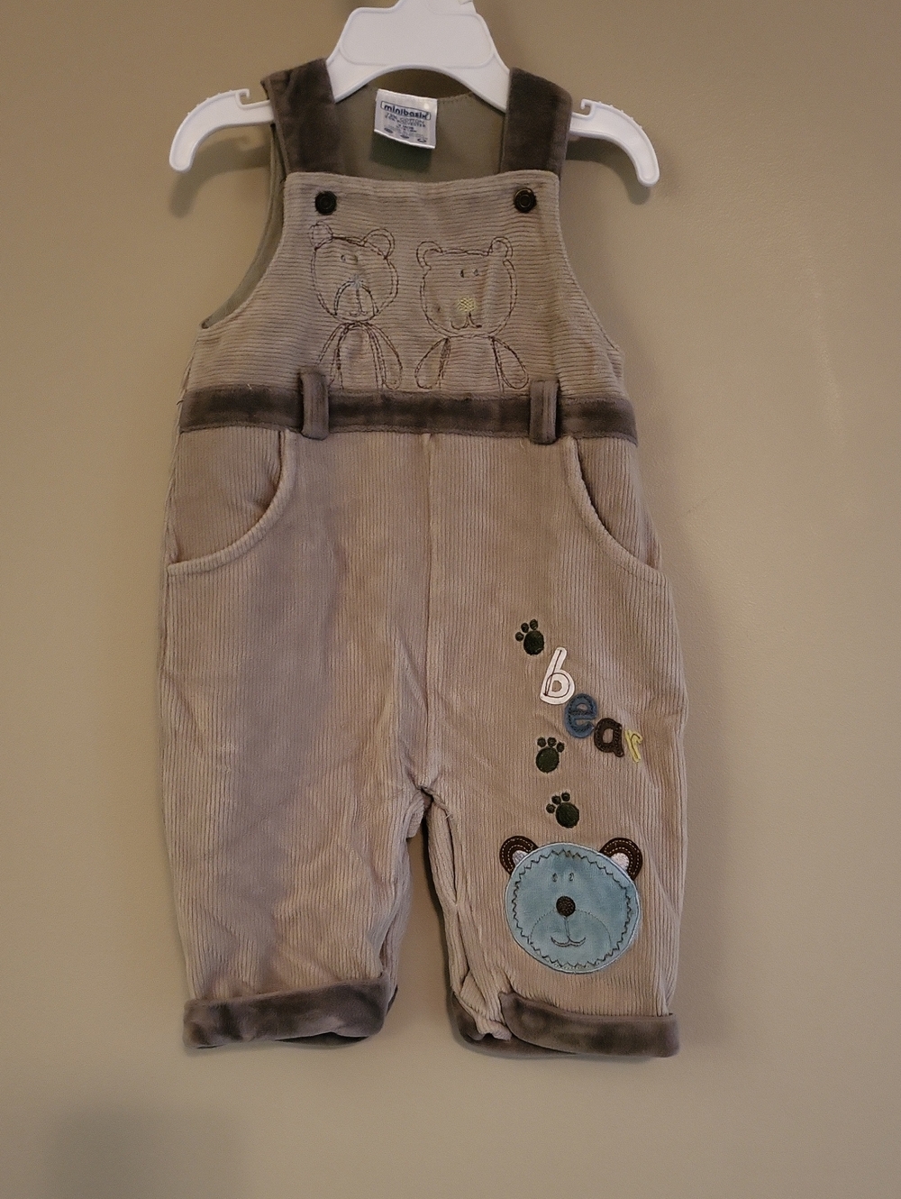 Soft tan corduroy overalls with bear detail